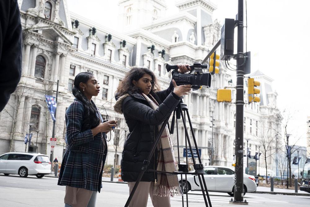 Journalism students setting up a shoot at Philadelphia City Hall.